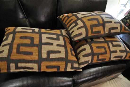 Appraisal: THREE DUCK DOWN CUSHIONS IN TRIBAL UPHOLSTERY