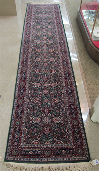 Appraisal: HAND KNOTTED ORIENTAL RUNNER Indo-Persian overall floral decoration on green