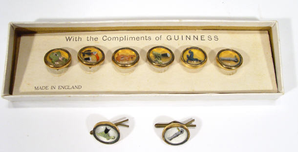 Appraisal: Set of six Guiness buttons and a pair of cuff