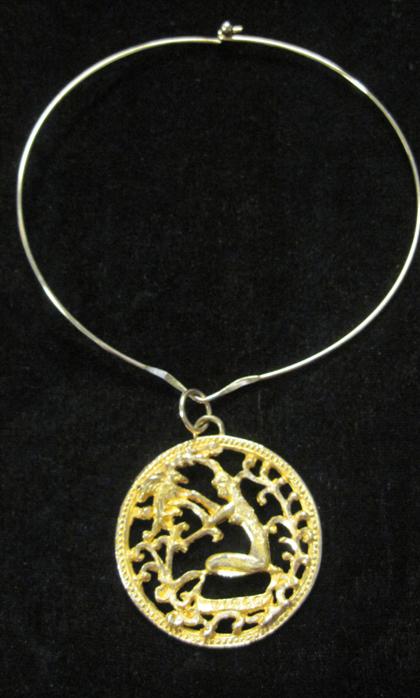 Appraisal: karat yellow gold 'Virgo' pendantDisk form of textured gold