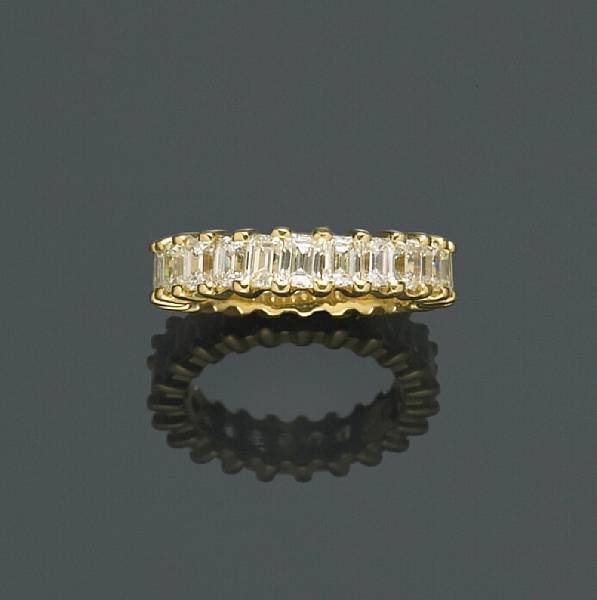 Appraisal: A diamond eternity band comprising twenty-three rectangular-cut diamonds estimated total