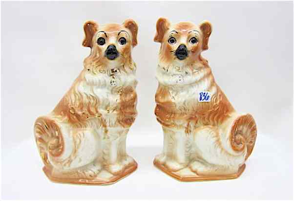 Appraisal: PAIR ENGLISH PORCELAIN STAFFORDSHIRE DOGS in opposing positions rust and