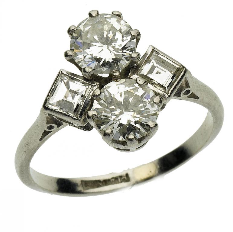 Appraisal: A DIAMOND RING the pair of transverse set evenly sized