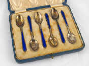 Appraisal: A cased set of six coffee spoons with blue enamelled