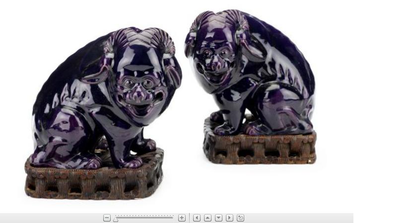 Appraisal: Large pair of Chinese purple glazed models of mythical beasts