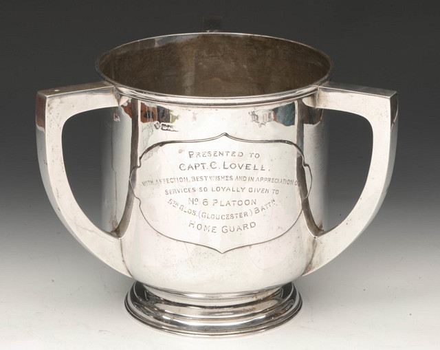 Appraisal: A SILVER TROPHY of circular form on pedestal foot with