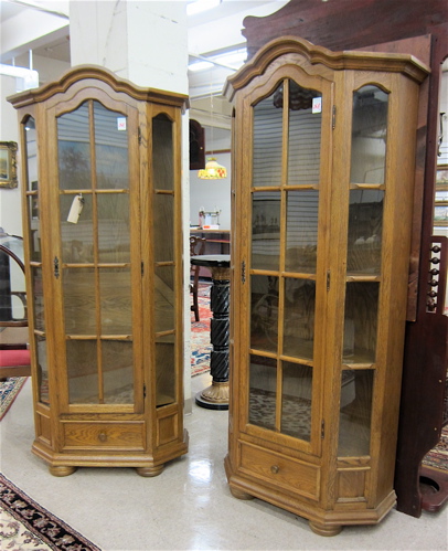 Appraisal: A PAIR OF OAK CURIO CABINETS Continental dated each centering