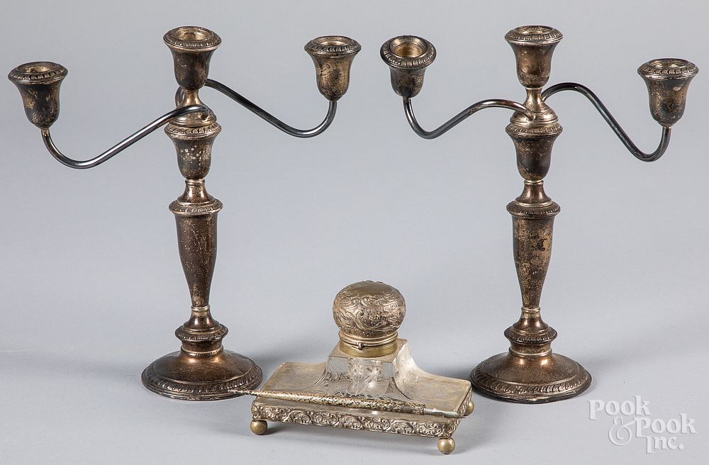 Appraisal: A pair of weighted sterling silver candelabra A pair of