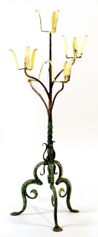 Appraisal: A wrought iron plant stand with green patination in the