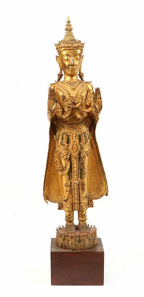 Appraisal: A Burmese style gilt metal standing Buddha with glass insets