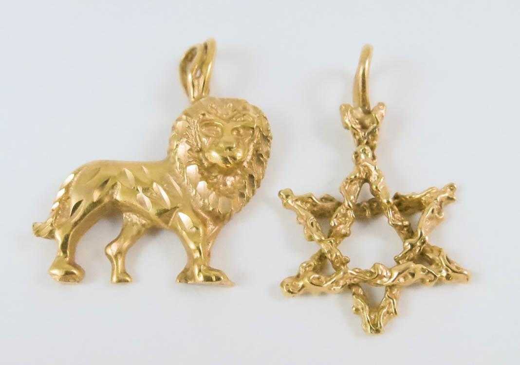 Appraisal: TWO FOURTEEN KARAT YELLOW GOLD PENDANTS including a yellow gold