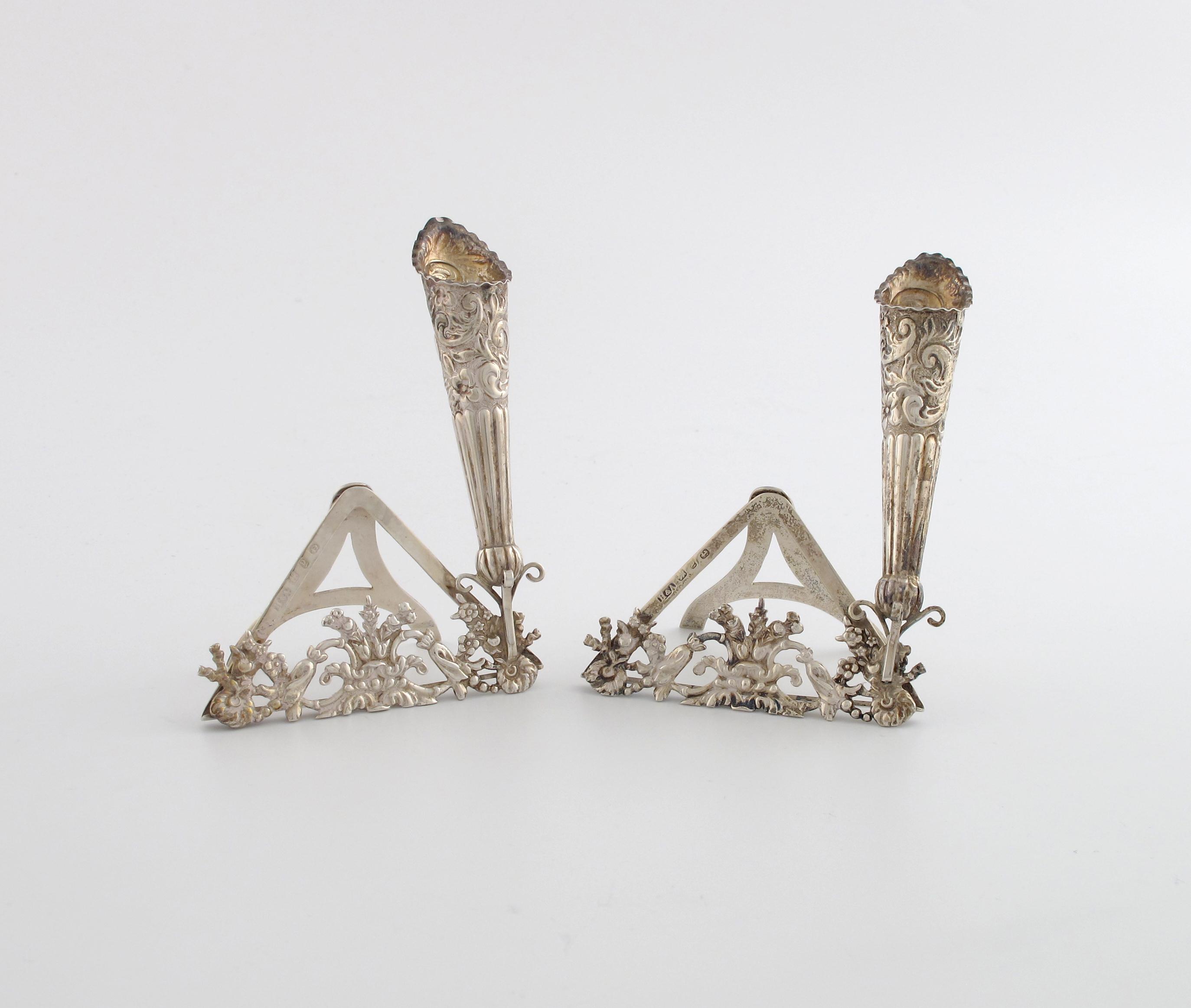 Appraisal: A pair of late-Victorian silver menu card holders vases