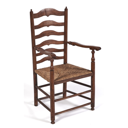 Appraisal: A Victorian ash ladder back elbow chair rush seated seat