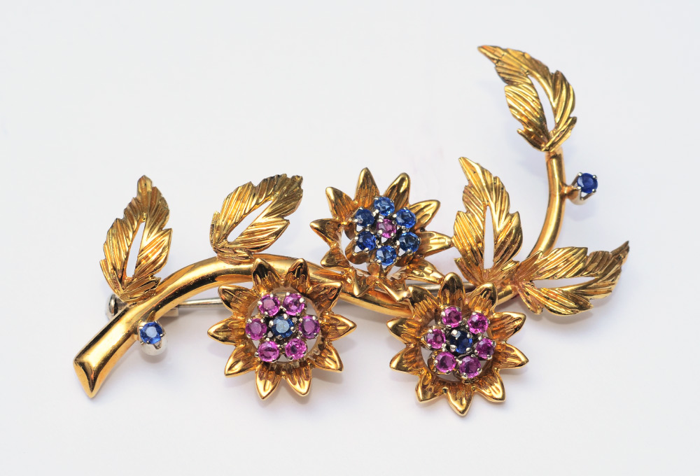 Appraisal: K GOLD RUBY AND SAPPHIRE FLORAL BROOCH K yellow gold