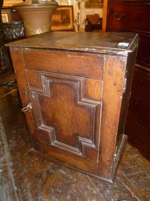 Appraisal: AN TH CENTURY OAK SPICE CUPBOARD fitted drawers with moulded