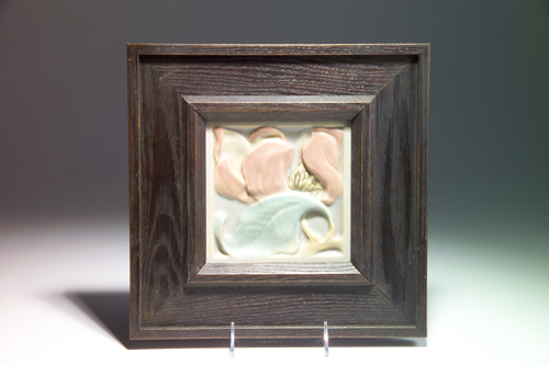 Appraisal: ROOKWOOD FAIENCE tile modeled with a pink magnolia and blue