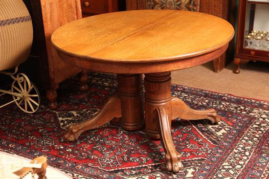 Appraisal: DOUBLE PEDASTAL TABLE Round oak table with turned pedastals claw