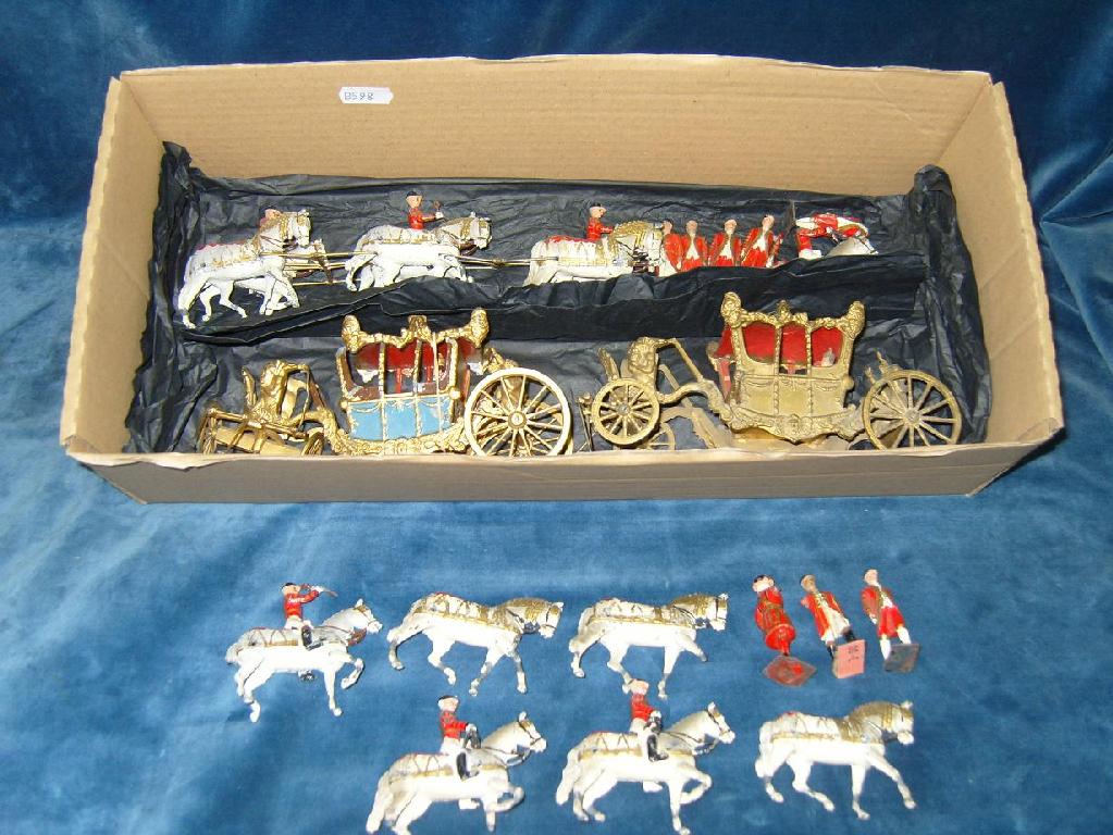 Appraisal: Two cast metal models of the Coronation coach together with