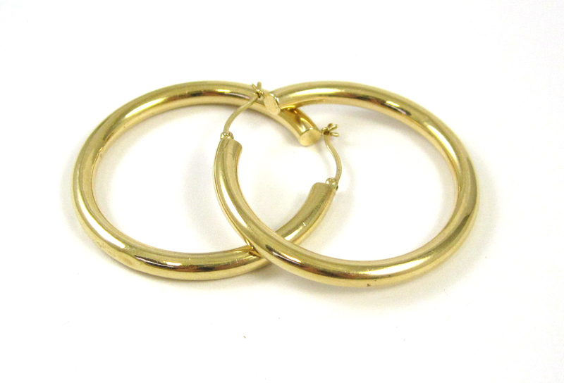 Appraisal: PAIR OF FOURTEEN KARAT GOLD HOOP EARRINGS Each large yellow