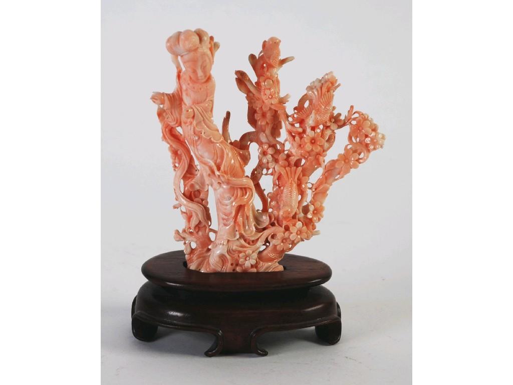 Appraisal: ORIENTAL CARVED PALE SALMON COLOURED CORAL GROUP modelled as a