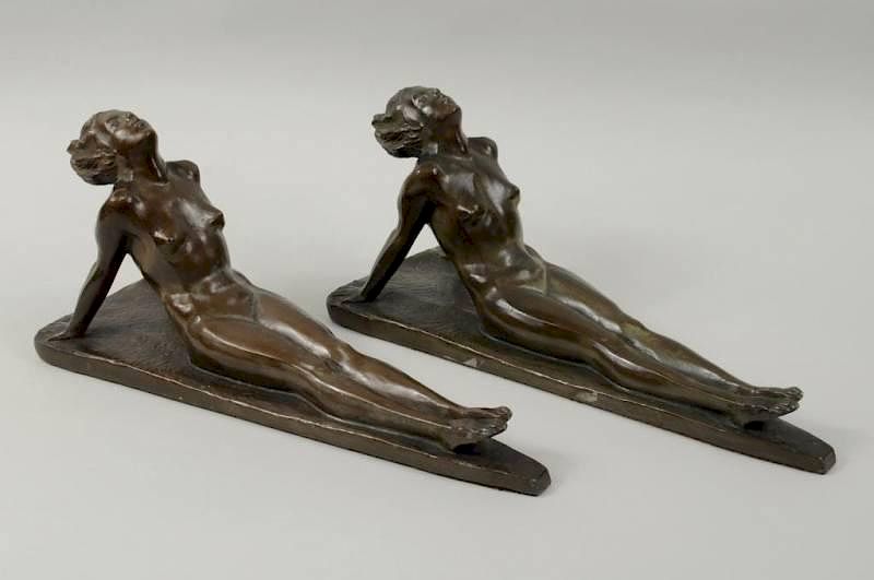 Appraisal: Pair Art Deco Reclining Nude Sculptures Pair of bronzed metal