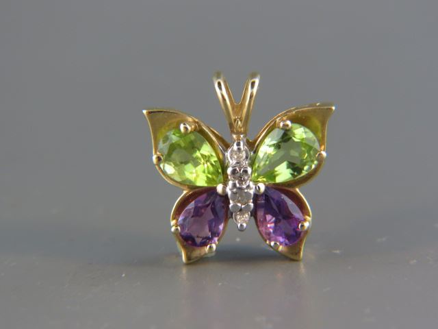 Appraisal: Diamond Peridot and Amethyst Butterfly Pendant round diamonds and pear