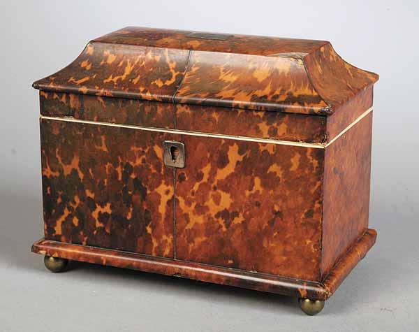 Appraisal: A Regency Tortoiseshell Tea Caddy sarcophagus form divided lidded interior