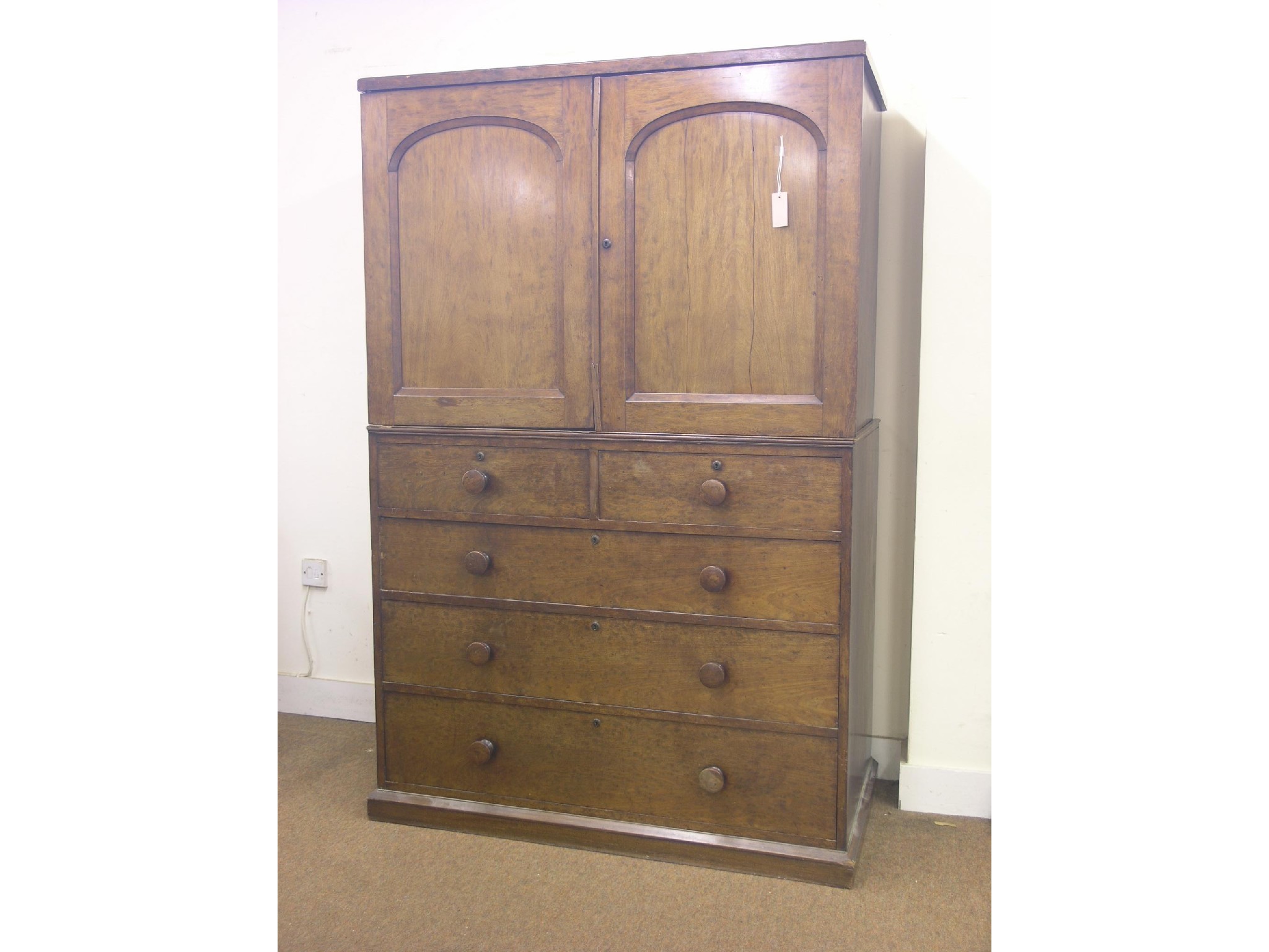 Appraisal: A Victorian mahogany linen press pair of domed panelled doors