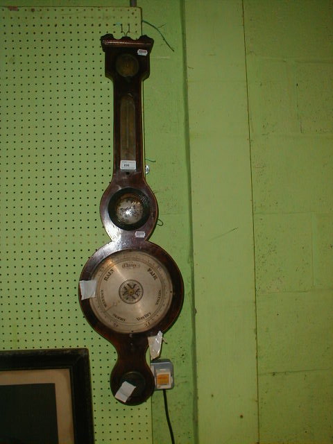 Appraisal: An early thC wheel barometer AF together with a spare