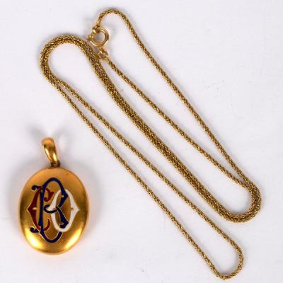 Appraisal: An ct yellow gold oval locket with monogram CBO to