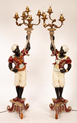 Appraisal: A pair of Venetian style blackamoor candelabra figures with painted