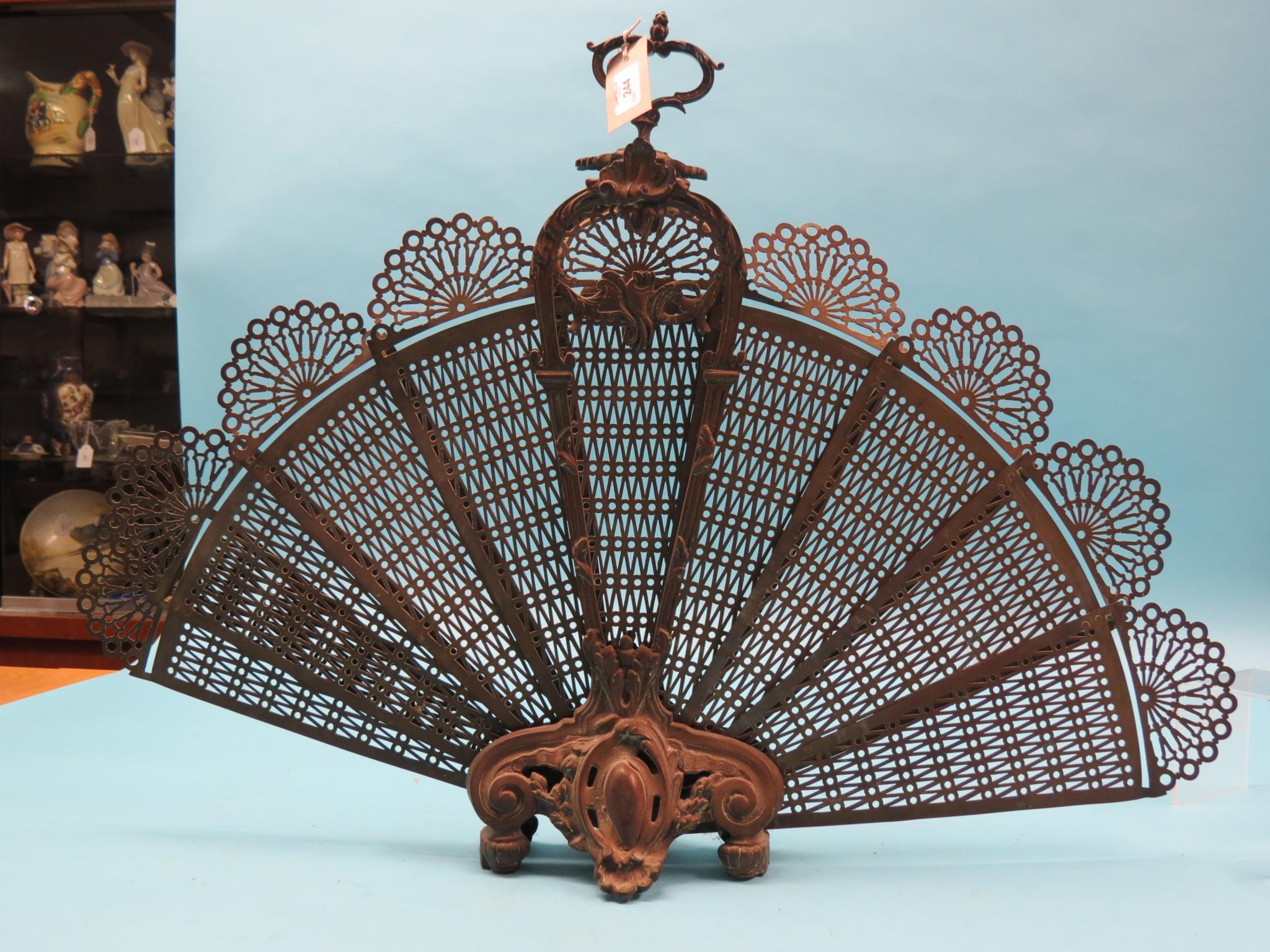 Appraisal: A Victorian peacock feather brass fire-screen folding in nine segments