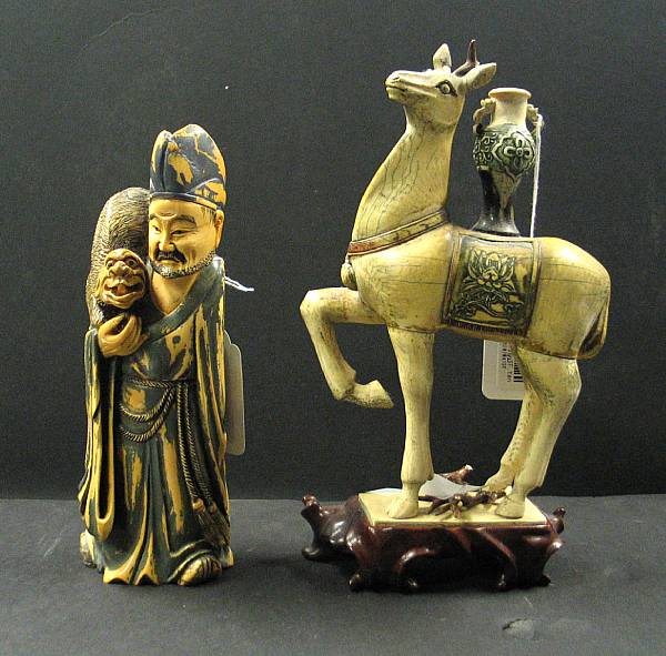 Appraisal: Two tinted ivory carvings The first a image of the