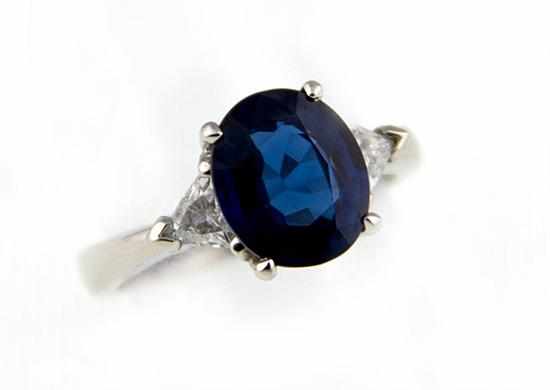 Appraisal: Sapphire diamond and platinum ring centered by oval blue sapphire