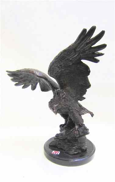 Appraisal: BRONZE WILDLIFE SCULPTURE depicting an eagle with wings raised overhead