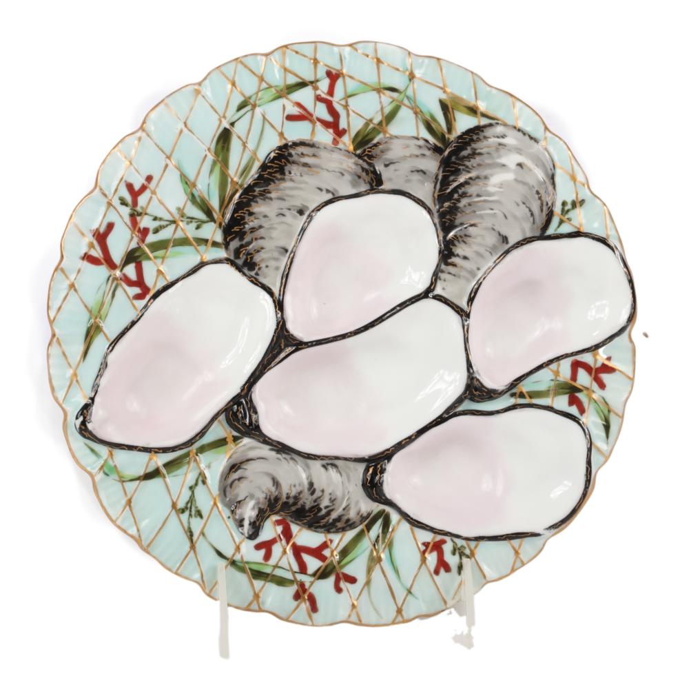 Appraisal: ANTIQUE PORCELAIN OYSTER SERVING PLATE WITH TURKEY PATTERN AND FISHNET