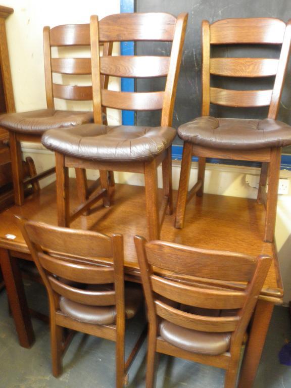 Appraisal: An oak draw leaf table and six oak ladder back