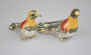 Appraisal: A pair of enamelled silver miniature doves