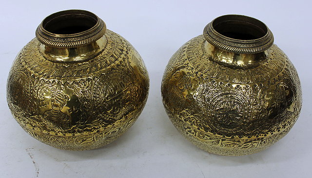 Appraisal: A PAIR OF INDIAN BRASS WATER CARRYING POTS with all