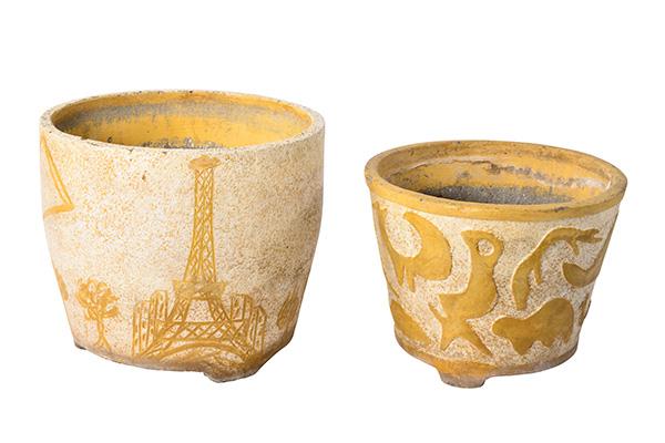 Appraisal: A PAIR OF FRENCH CONCRETE PLANTERS ONE DEPICTING EIFFEL TOWER