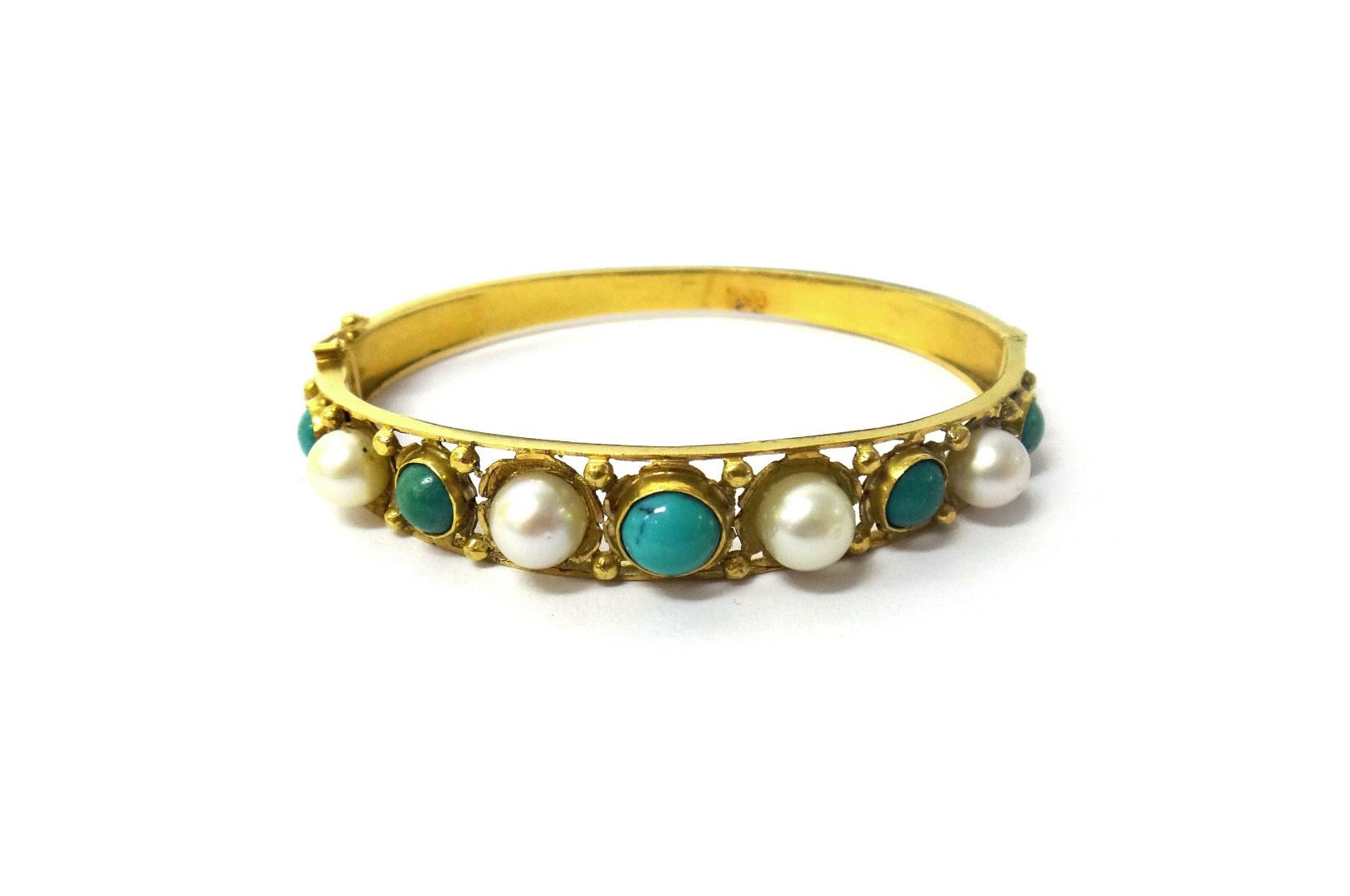 Appraisal: A gold turquoise and cultured pearl set oval hinged bangle