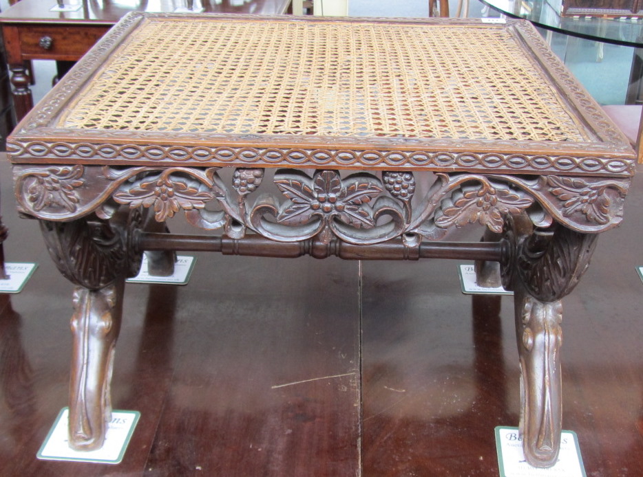 Appraisal: A th century Anglo Indian teak stool with cane work