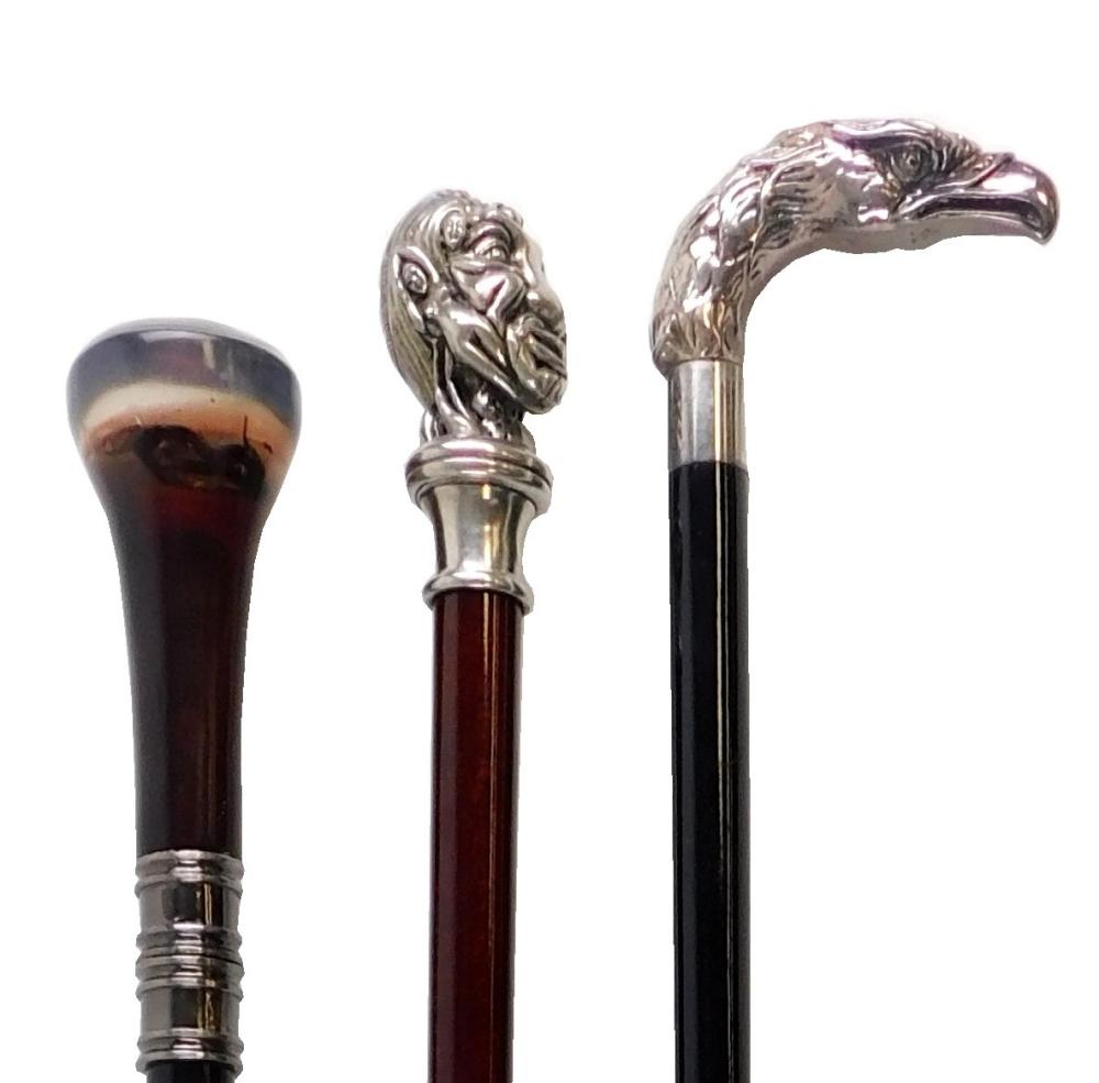 Appraisal: Three walking sticks Sterling silver eagle head handle black lacquer