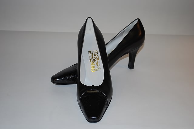 Appraisal: Salvatore Ferragamo black leather pumps with snakeskin toe trim Size