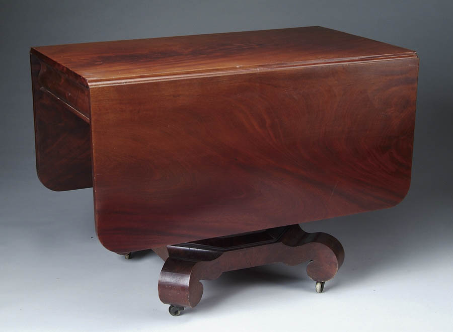 Appraisal: MAHOGANY EMPIRE DROP LEAF TABLE Two curved corner drop leaves