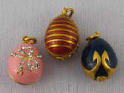 Appraisal: A mixed lot comprising three Russian gilt and enamel egg