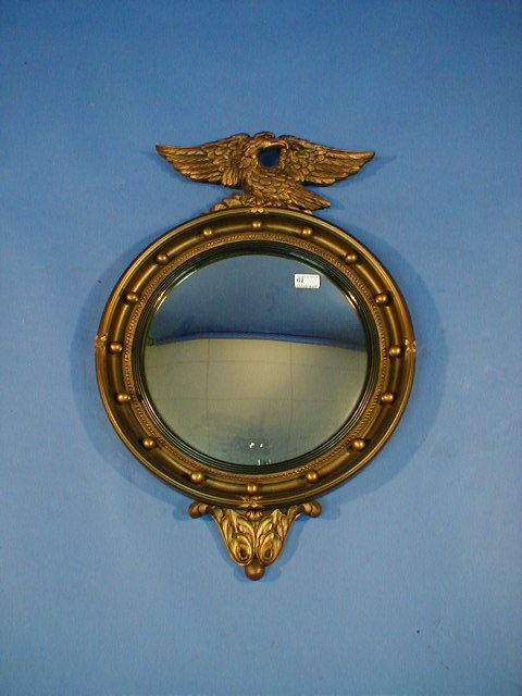 Appraisal: A Regency style gilt circular wall mirror with eagle mount