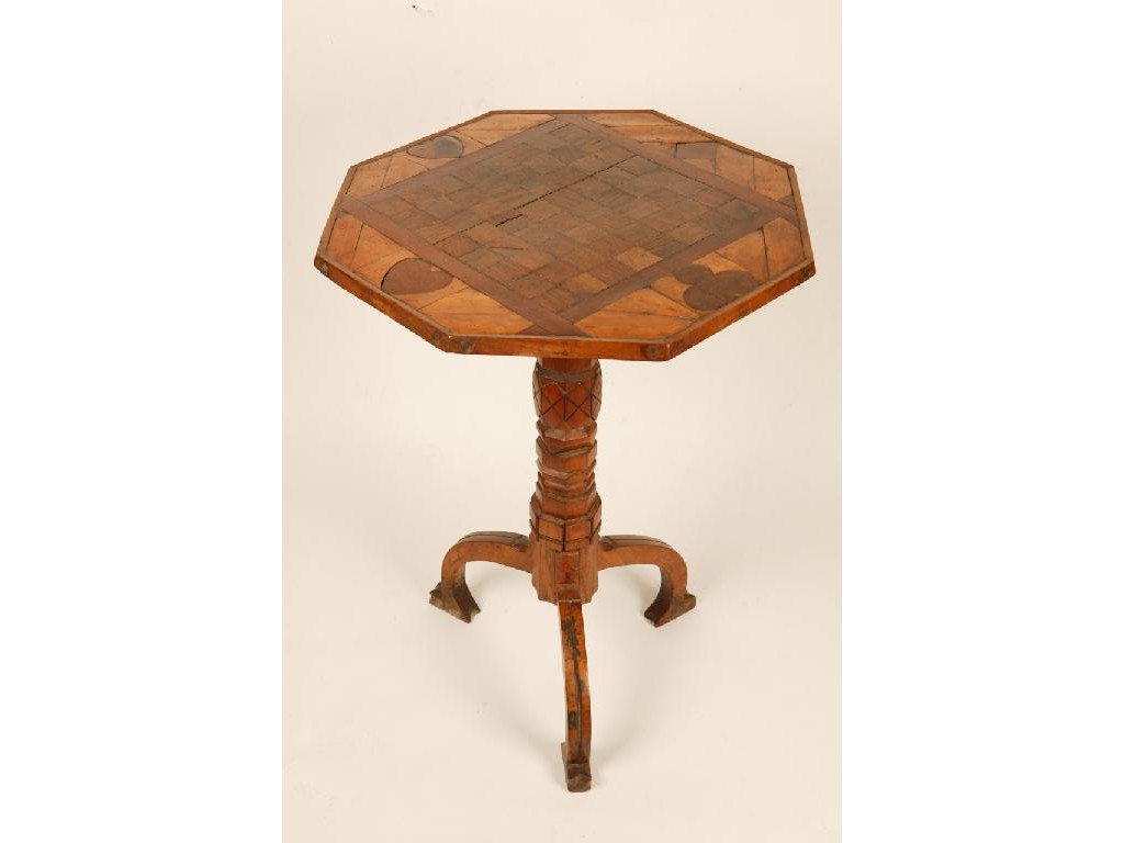 Appraisal: A VICTORIAN PARQUETRY GAMES TABLE the octagonal top inlaid with