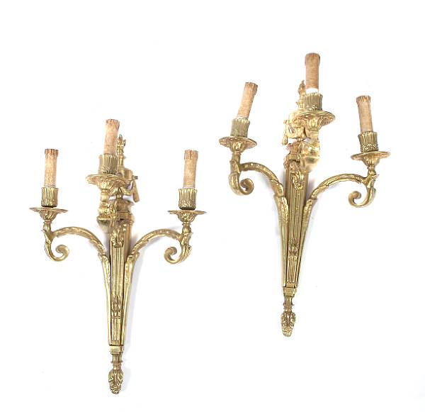 Appraisal: A pair of Neoclassical style gilt bronze three light sconces