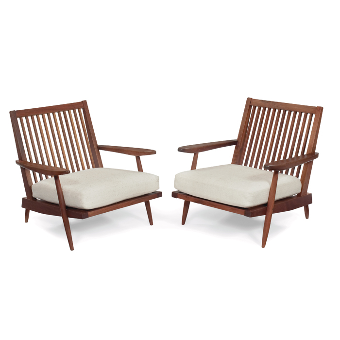 Appraisal: George Nakashima lounge chairs pair walnut paddle-shaped armrests slab seat